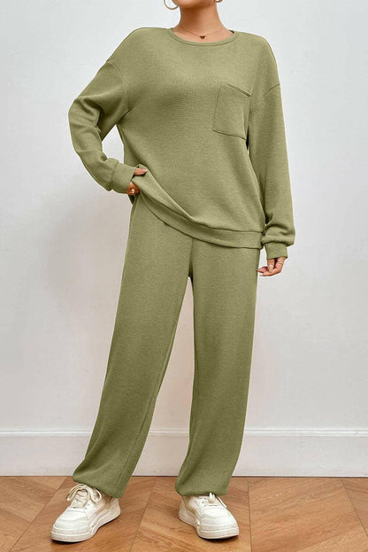 Cozy Lounge Set with Pocketed Two-Piece Top and PantsExperience Ultimate Comfort and Style with Our Cozy Lounge Set
 Unwind in luxury with our stylish Pocketed Round Neck Top and Pants Lounge Set, designed for both relLove Salve Cozy Lounge Setlounge