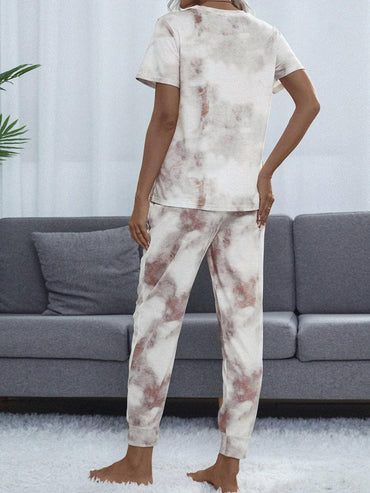 Trendy Tie-Dye Lounge Set with Round Neck Top and BottomsUpgrade Your Loungewear Game with Our Trendy Tie-Dye Lounge Set
 Experience the ultimate blend of style and comfort with our two-piece lounge set featuring a chic tiLove Salve Trendy Tie-Dye Lounge Setlounge