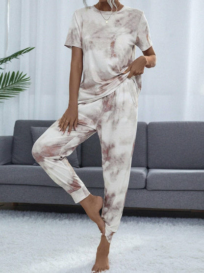 Trendy Tie-Dye Lounge Set with Round Neck Top and BottomsUpgrade Your Loungewear Game with Our Trendy Tie-Dye Lounge Set
 Experience the ultimate blend of style and comfort with our two-piece lounge set featuring a chic tiLove Salve Trendy Tie-Dye Lounge Setlounge