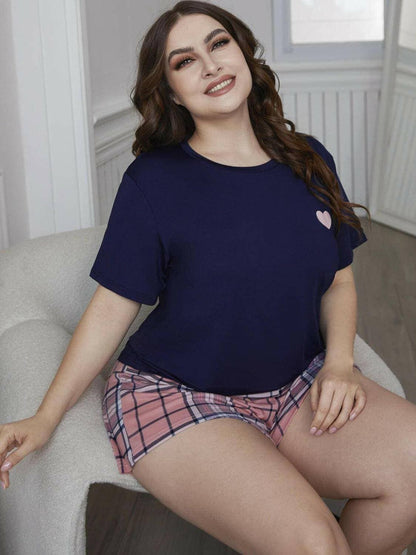 Cozy Heart Print Plus Size Lounge Duo with Plaid ShortsUpgrade Your Loungewear with Style and Comfort
 
 Flatter your curves in this perfectly sized lounge set designed for plus figures
 Chic heart graphic top paired witLove Salve Cozy Heart Printlounge