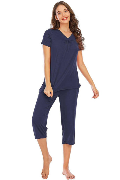 Ultimate Comfort Lounge Set with a Modern TwistExperience Ultimate Comfort with a Modern Twist
 Indulge in luxurious comfort while exuding style with our V-Neck Short Sleeve Top and Pants Lounge Set. Whether you'Love Salve Ultimate Comfort Lounge Setlounge