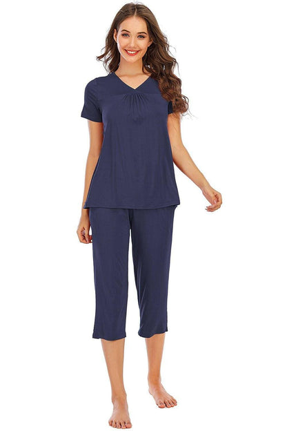 Ultimate Comfort Lounge Set with a Modern TwistExperience Ultimate Comfort with a Modern Twist
 Indulge in luxurious comfort while exuding style with our V-Neck Short Sleeve Top and Pants Lounge Set. Whether you'Love Salve Ultimate Comfort Lounge Setlounge