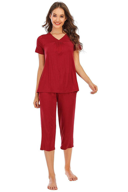 Ultimate Comfort Lounge Set with a Modern TwistExperience Ultimate Comfort with a Modern Twist
 Indulge in luxurious comfort while exuding style with our V-Neck Short Sleeve Top and Pants Lounge Set. Whether you'Love Salve Ultimate Comfort Lounge Setlounge