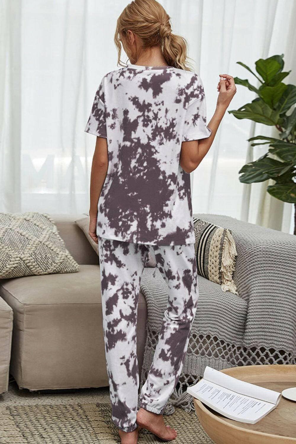 Trendy Tie-Dye Lounge Set with Tee and JoggersTrendy Tie-Dye Lounge Set with Tee and Joggers
 Upgrade your loungewear game with this standout two-piece set that combines style and comfort seamlessly.
 
 Key FeatLove Salve Trendy Tie-Dye Lounge Setlounge