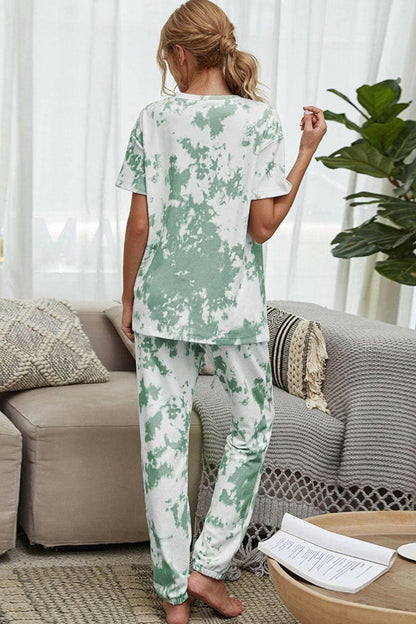 Trendy Tie-Dye Lounge Set with Tee and JoggersTrendy Tie-Dye Lounge Set with Tee and Joggers
 Upgrade your loungewear game with this standout two-piece set that combines style and comfort seamlessly.
 
 Key FeatLove Salve Trendy Tie-Dye Lounge Setlounge