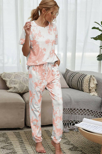 Trendy Tie-Dye Lounge Set with Tee and JoggersTrendy Tie-Dye Lounge Set with Tee and Joggers
 Upgrade your loungewear game with this standout two-piece set that combines style and comfort seamlessly.
 
 Key FeatLove Salve Trendy Tie-Dye Lounge Setlounge