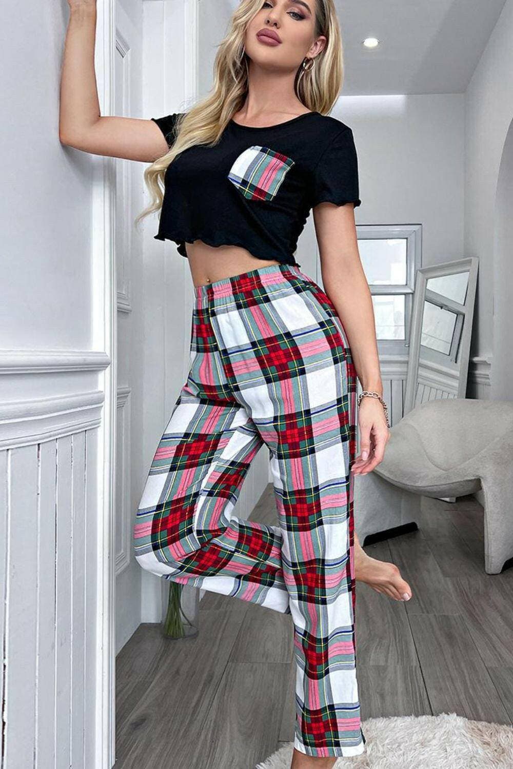 Cozy plaid lounge set with trim, featuring cropped t-shirt and plaid pants for stylish comfort.