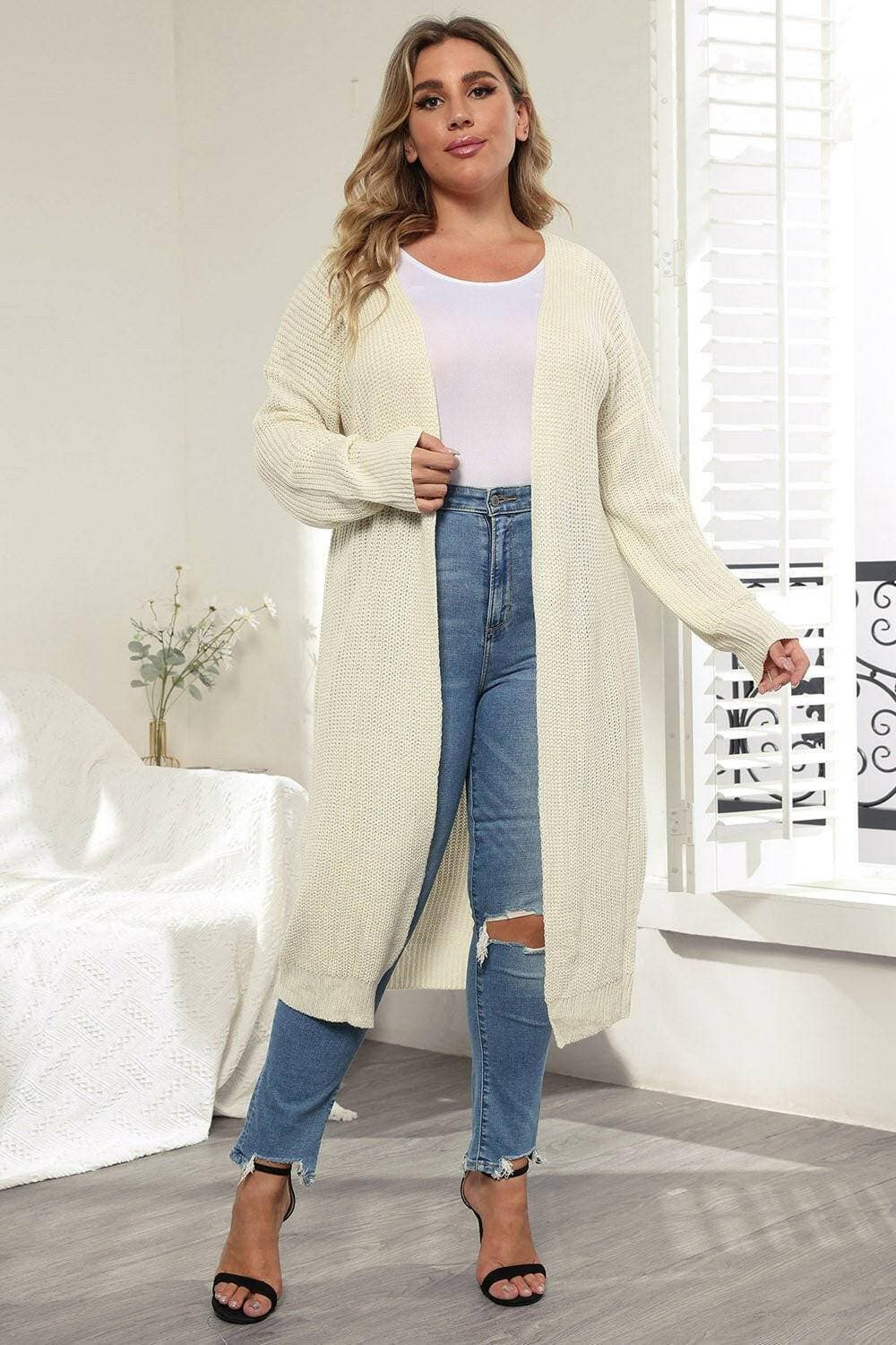 Cozy Oversized Knit CardiganWrap Yourself in Ultimate Comfort with Our Cozy Oversized Knit Cardigan
 Indulge in the luxurious warmth and style of our Cozy Oversized Knit Cardigan. Crafted from Love Salve Cozy Oversized Knit Cardiganplus