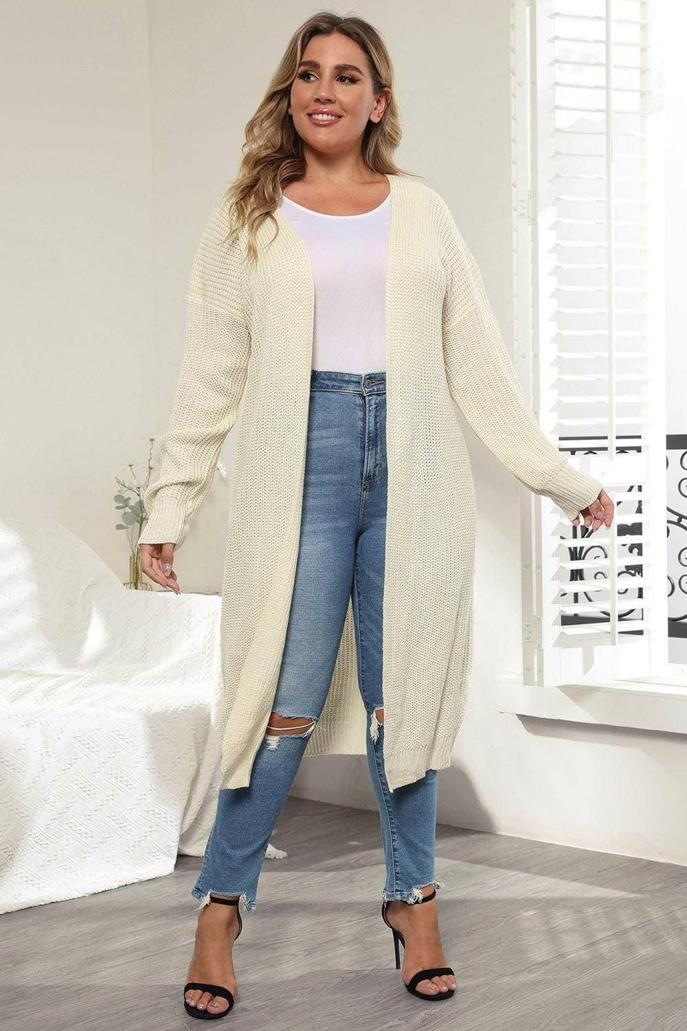 Cozy Oversized Knit CardiganWrap Yourself in Ultimate Comfort with Our Cozy Oversized Knit Cardigan
 Indulge in the luxurious warmth and style of our Cozy Oversized Knit Cardigan. Crafted from Love Salve Cozy Oversized Knit Cardiganplus