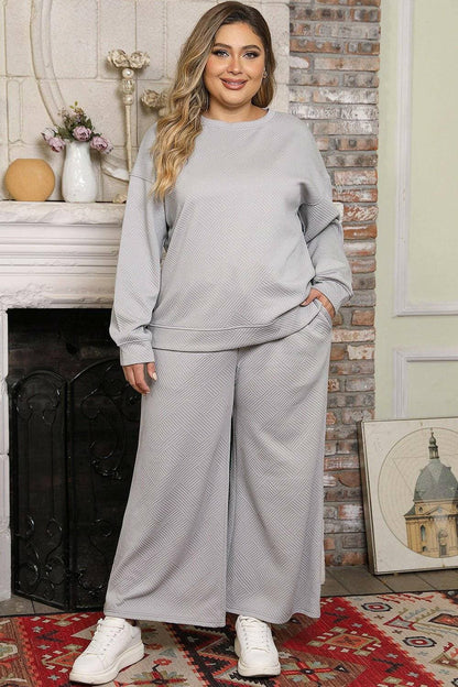 Curvy Fit Drop Shoulder Top and Trousers EnsembleCurvy Fit Drop Shoulder Top and Trousers Ensemble
 Step into elegance and sophistication with our Curvy Fit Drop Shoulder Ensemble. Elevate your style effortlessly wLove Salve Curvy Fit Drop Shoulder Topplus