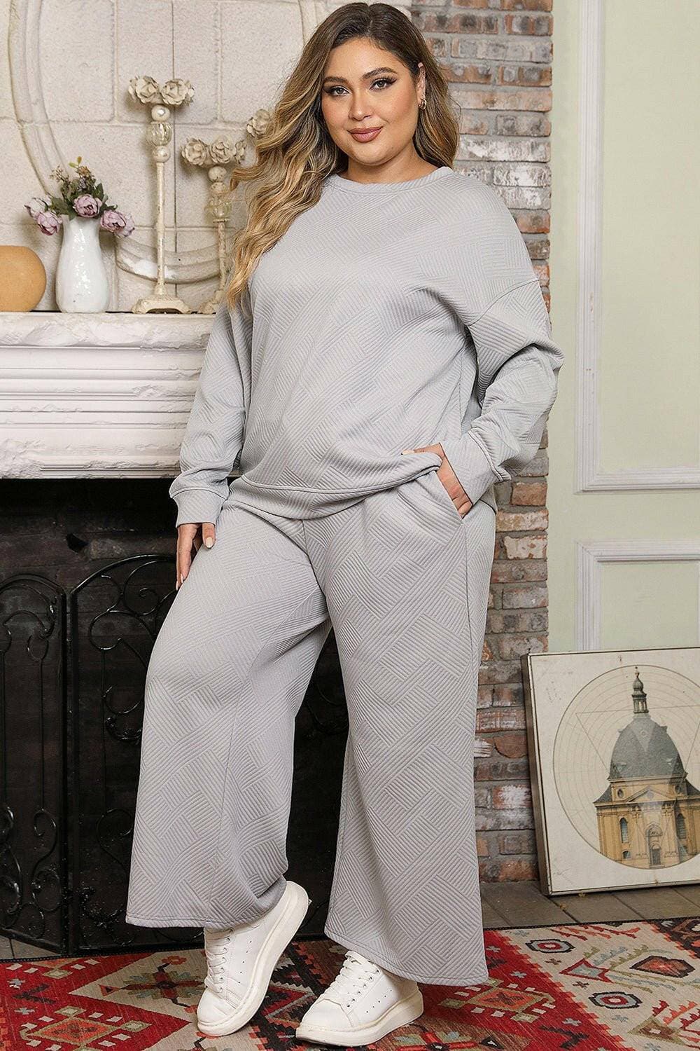 Curvy Fit Drop Shoulder Top and Trousers EnsembleCurvy Fit Drop Shoulder Top and Trousers Ensemble
 Step into elegance and sophistication with our Curvy Fit Drop Shoulder Ensemble. Elevate your style effortlessly wLove Salve Curvy Fit Drop Shoulder Topplus