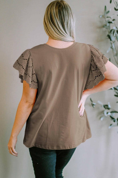 Elegant eyelet blouse for plus size women with short sleeves