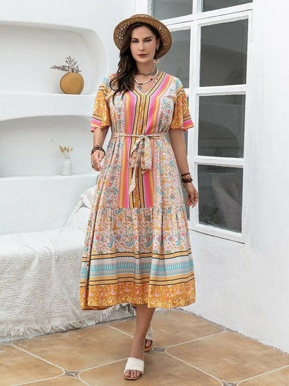 Floral plus size short sleeve maxi dress in multicolored print, perfect for summer occasions.