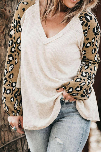 Leopard Print V-Neck Plus Size Blouse with Raglan SleevesUpgrade Your Wardrobe with Style and Comfort
 Indulge in the chic elegance of our Leopard Print V-Neck Plus Size Blouse with Raglan Sleeves. Elevate your look with tLove Salve Leopard Printplus