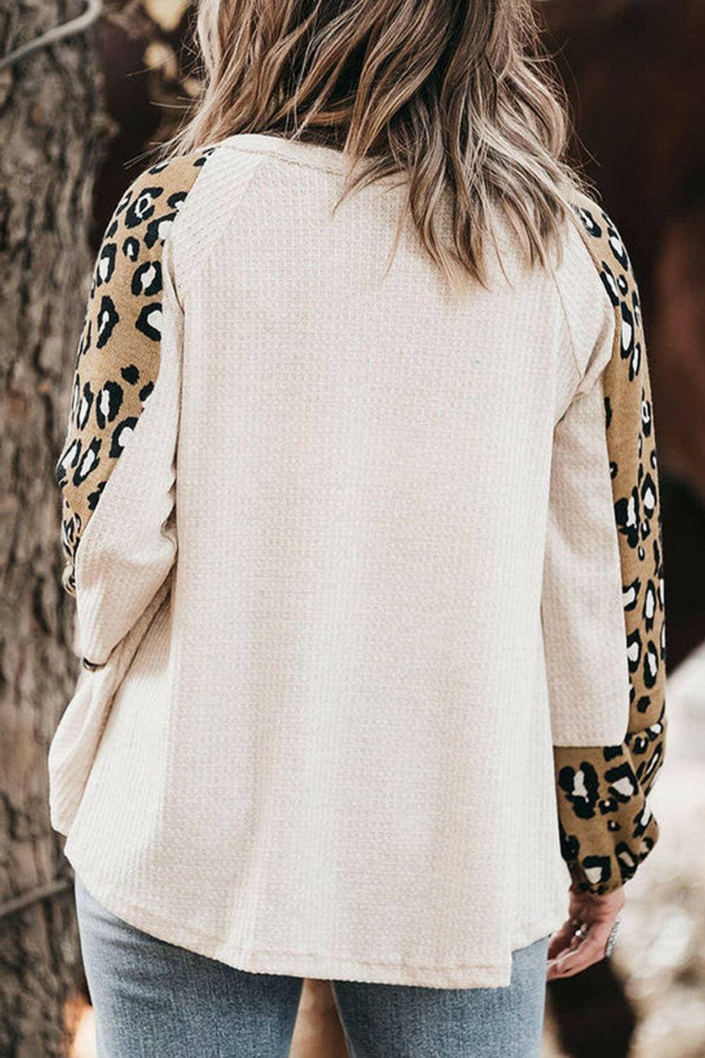 Leopard Print V-Neck Plus Size Blouse with Raglan SleevesUpgrade Your Wardrobe with Style and Comfort
 Indulge in the chic elegance of our Leopard Print V-Neck Plus Size Blouse with Raglan Sleeves. Elevate your look with tLove Salve Leopard Printplus