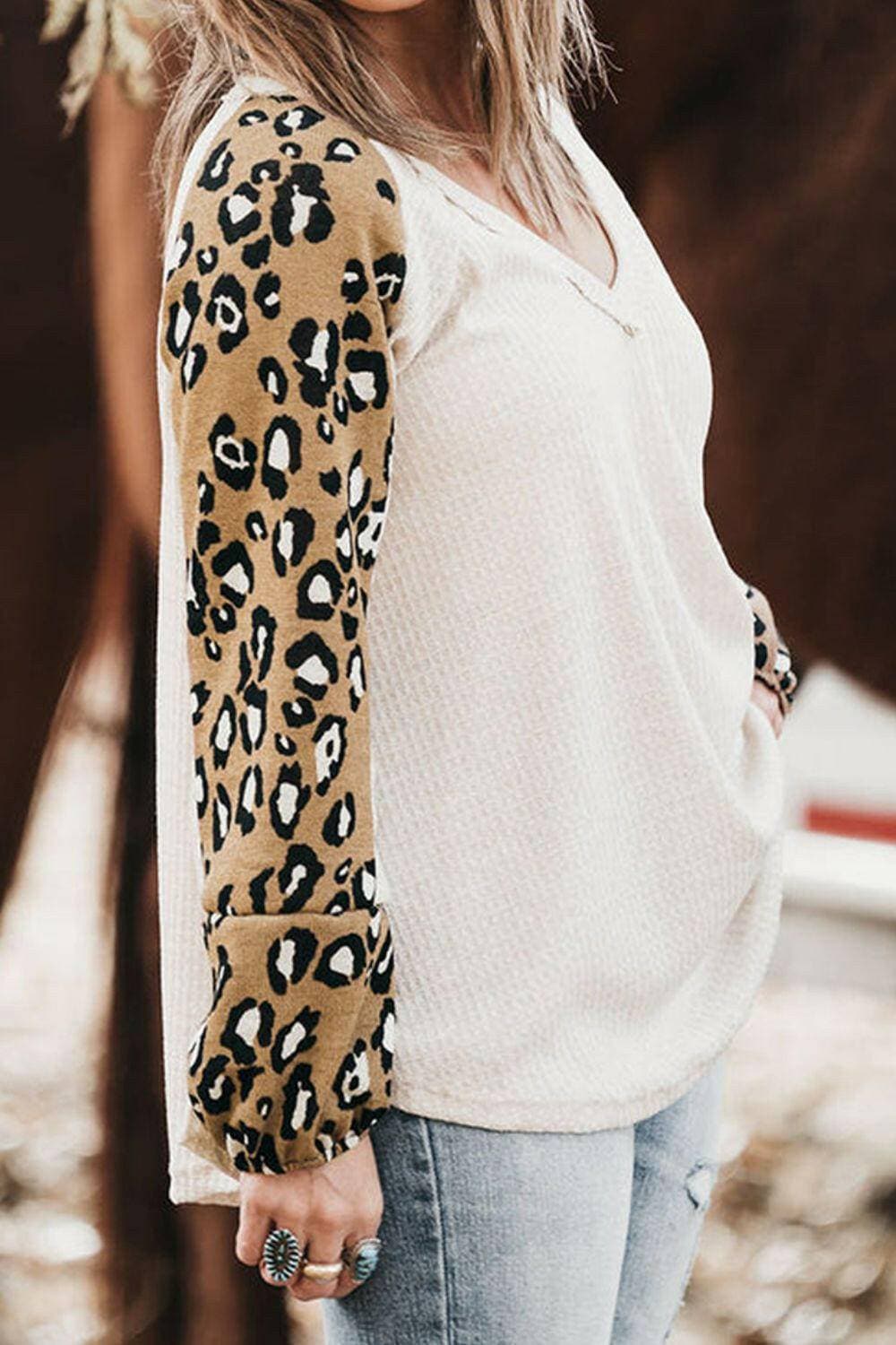 Leopard Print V-Neck Plus Size Blouse with Raglan SleevesUpgrade Your Wardrobe with Style and Comfort
 Indulge in the chic elegance of our Leopard Print V-Neck Plus Size Blouse with Raglan Sleeves. Elevate your look with tLove Salve Leopard Printplus