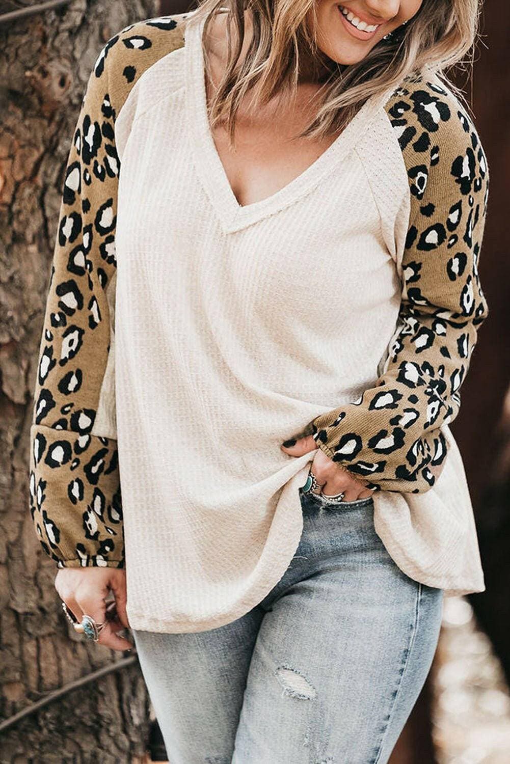 Leopard Print V-Neck Plus Size Blouse with Raglan SleevesUpgrade Your Wardrobe with Style and Comfort
 Indulge in the chic elegance of our Leopard Print V-Neck Plus Size Blouse with Raglan Sleeves. Elevate your look with tLove Salve Leopard Printplus