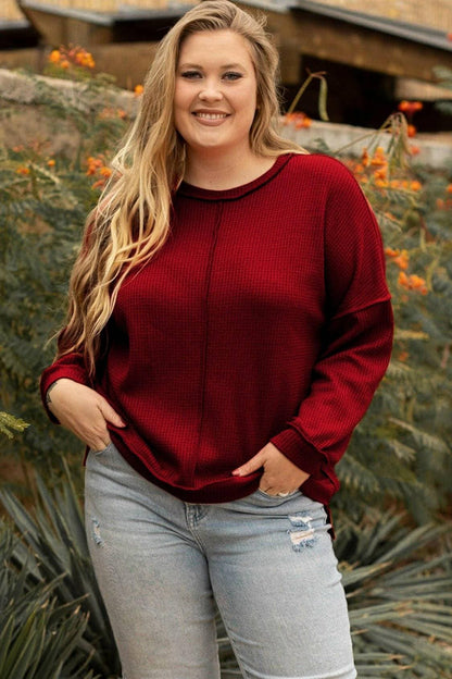 Curvy chic: Waffle-knit high-low sweatshirt with trendy exposed seams