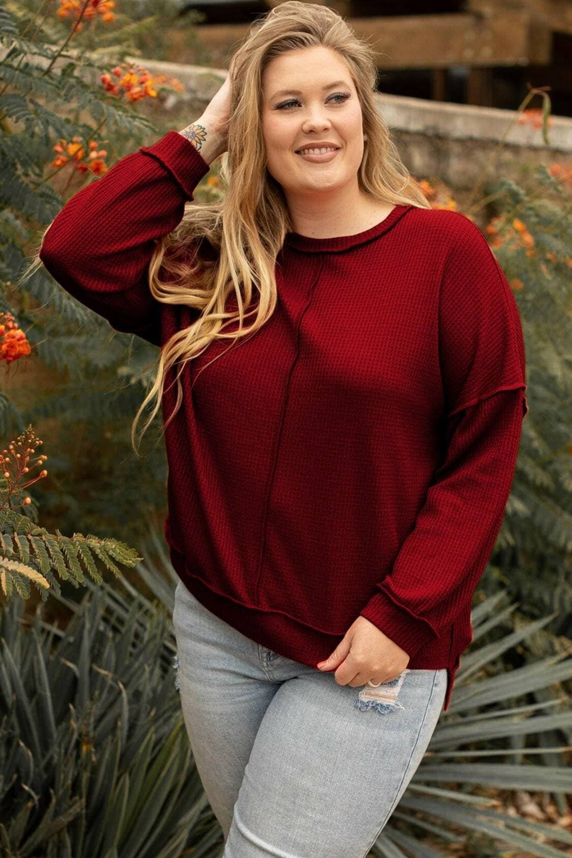 Curvy chic: Waffle-knit high-low sweatshirt with trendy exposed seams