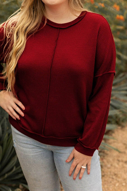 Curvy chic: Waffle-knit high-low sweatshirt with trendy exposed seams