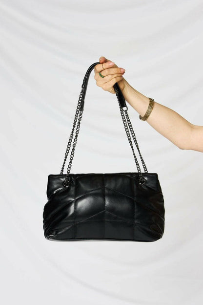 Luxurious Faux Leather Handbag with Chain StrapExperience Elegance and Sustainability
 Luxurious Appeal: Elevate your look with this sophisticated faux leather handbag that exudes luxury and style.
 
 SustainableLove Salve Luxurious Faux Leather HandbagShoes