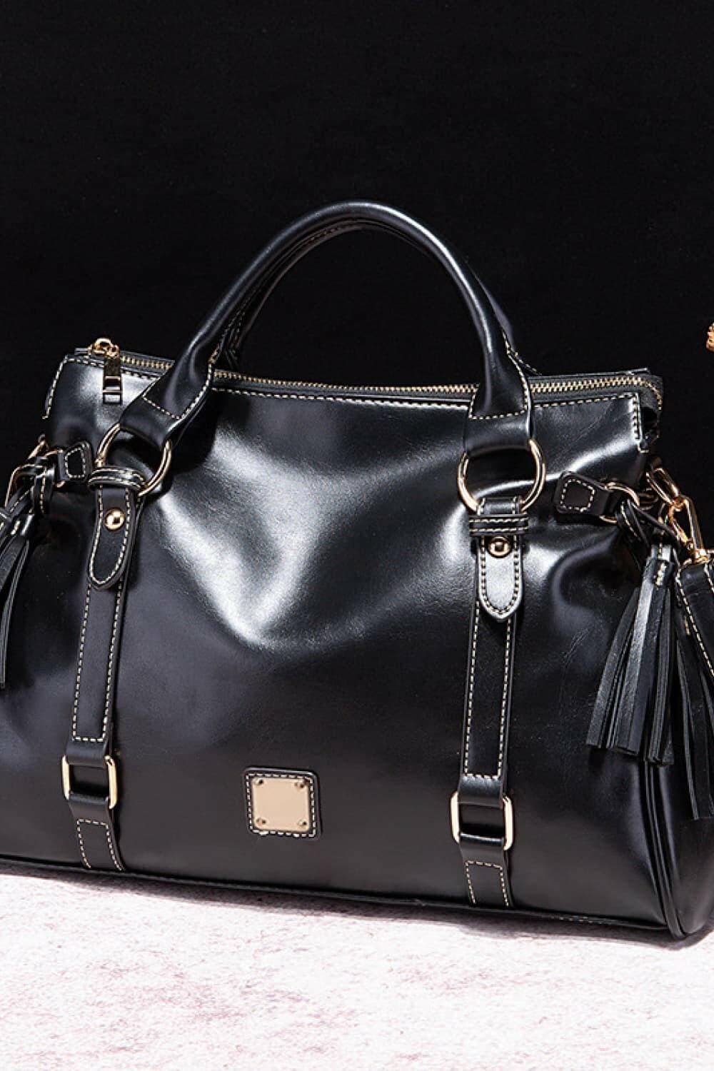 Tassel Accent Large PU Leather HandbagTassel Accent Large PU Leather Handbag
 Upgrade your style with our Tassel Accent Large PU Leather Handbag, a perfect blend of functionality and fashion.
 
 Key FeatLove Salve Tassel Accent Large PU Leather HandbagShoes