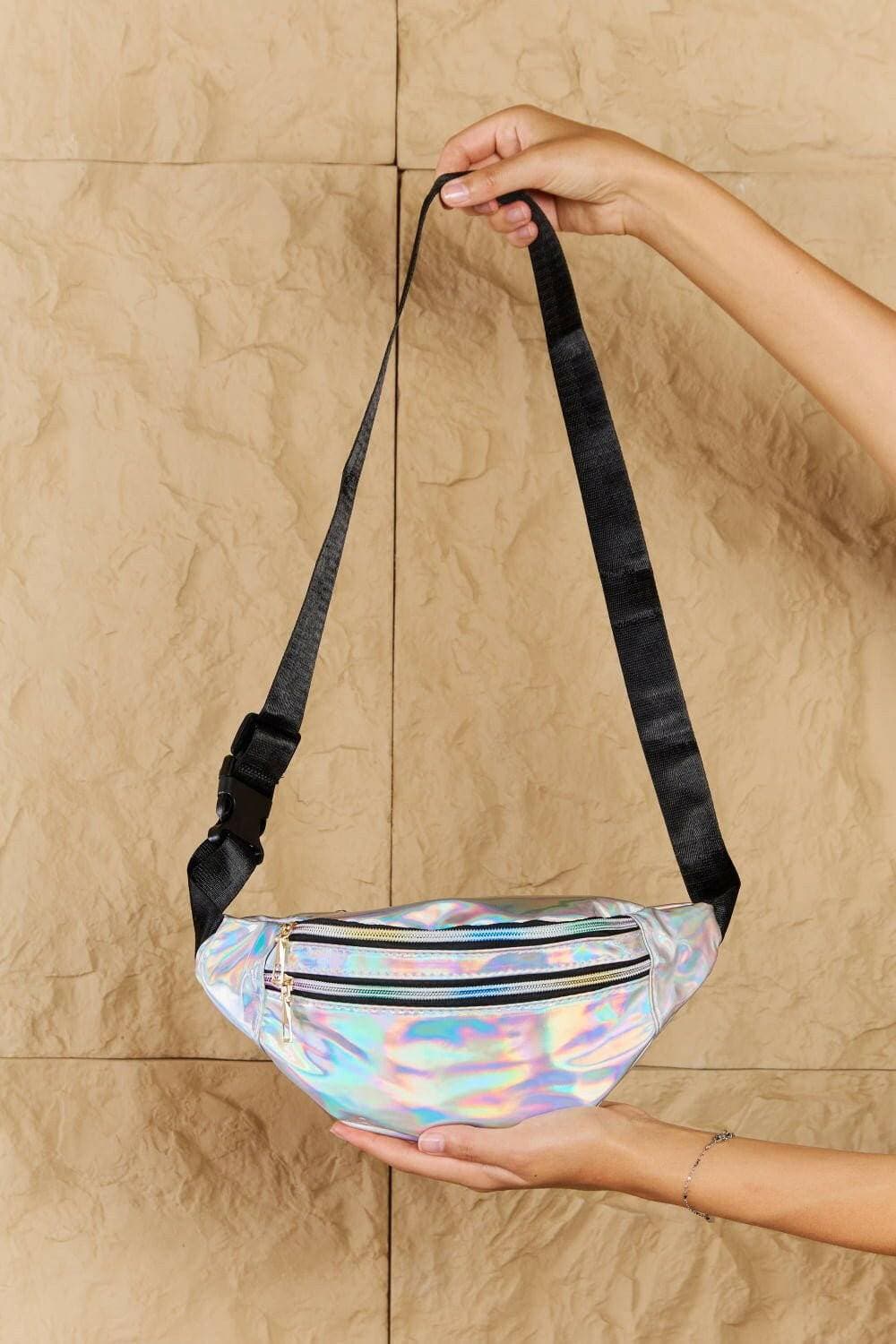 Shimmering silver holographic fanny pack with dual zippers