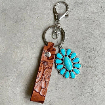 Turquoise Leather Keychain with Alloy and Iron AccentsStand out with Style
 
 
Mix of Materials: Crafted with a unique blend of alloy, iron, and genuine leather, this keychain is a standout accessory.
 
Turquoise AccentLove Salve Turquoise Leather KeychainShoes