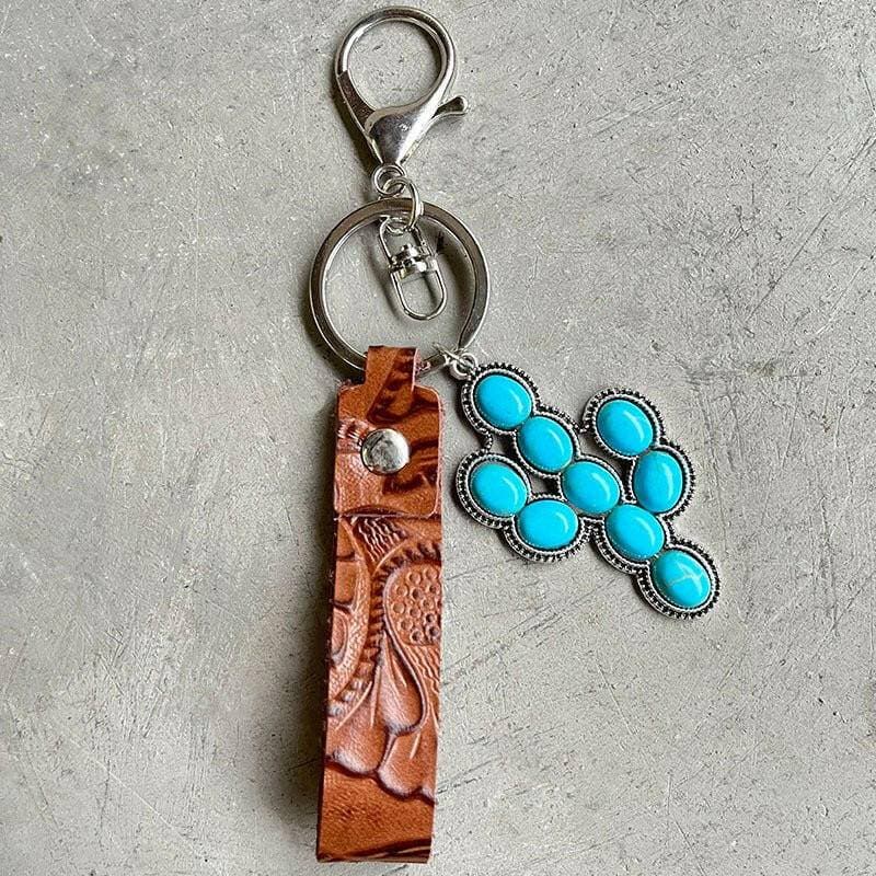 Turquoise Leather Keychain with Alloy and Iron AccentsStand out with Style
 
 
Mix of Materials: Crafted with a unique blend of alloy, iron, and genuine leather, this keychain is a standout accessory.
 
Turquoise AccentLove Salve Turquoise Leather KeychainShoes