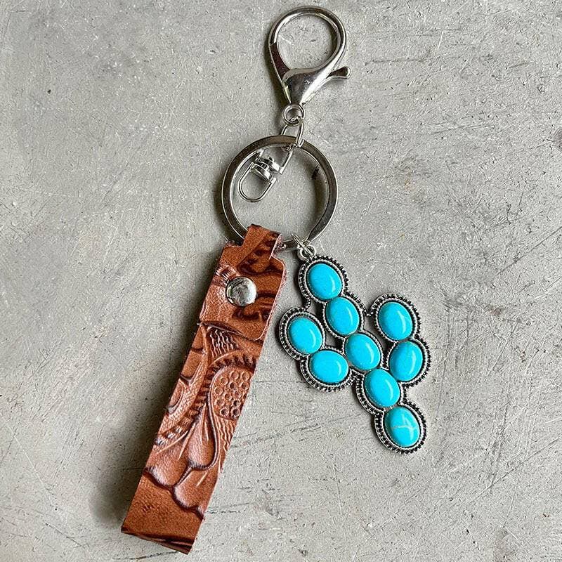 Turquoise Leather Keychain with Alloy and Iron AccentsStand out with Style
 
 
Mix of Materials: Crafted with a unique blend of alloy, iron, and genuine leather, this keychain is a standout accessory.
 
Turquoise AccentLove Salve Turquoise Leather KeychainShoes