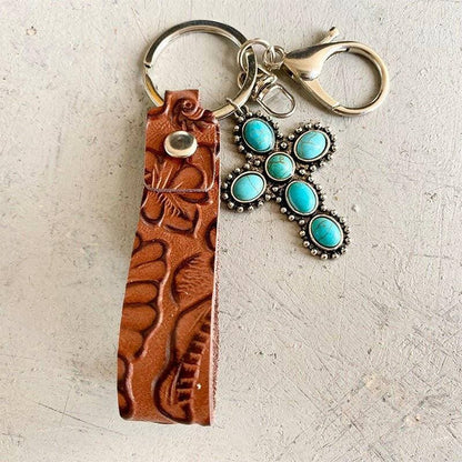 Turquoise Leather Keychain with Alloy and Iron AccentsStand out with Style
 
 
Mix of Materials: Crafted with a unique blend of alloy, iron, and genuine leather, this keychain is a standout accessory.
 
Turquoise AccentLove Salve Turquoise Leather KeychainShoes