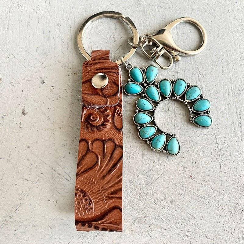 Turquoise Leather Keychain with Alloy and Iron AccentsStand out with Style
 
 
Mix of Materials: Crafted with a unique blend of alloy, iron, and genuine leather, this keychain is a standout accessory.
 
Turquoise AccentLove Salve Turquoise Leather KeychainShoes