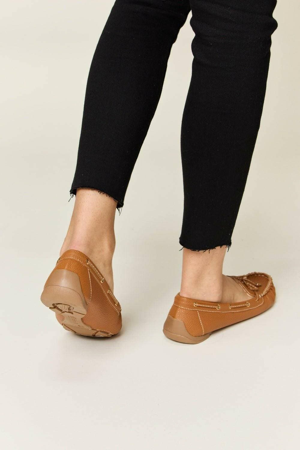 Elegant Bow Embellished Flat Loafers in Faux LeatherStep into Elegance
 Enhance your outfit effortlessly with these Elegant Bow Embellished Flat Loafers in high-quality faux leather. Designed to provide a sophisticateLove Salve Elegant Bow Embellished Flat LoafersShoes