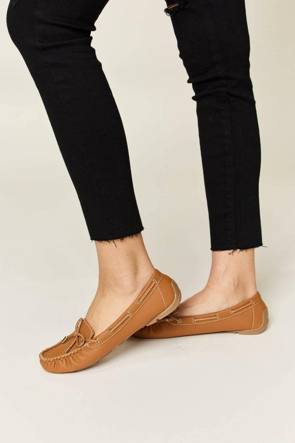 Elegant Bow Embellished Flat Loafers in Faux LeatherStep into Elegance
 Enhance your outfit effortlessly with these Elegant Bow Embellished Flat Loafers in high-quality faux leather. Designed to provide a sophisticateLove Salve Elegant Bow Embellished Flat LoafersShoes