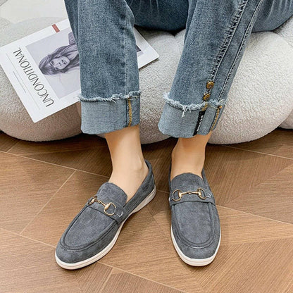 Suede Slip-On Flats with Metal BuckleSuede Slip-On Flats with Metal Buckle
 Indulge in chic sophistication with our Suede Slip-On Flats adorned with a classy Metal Buckle. Elevate your everyday look witLove Salve Suede Slip-Shoes