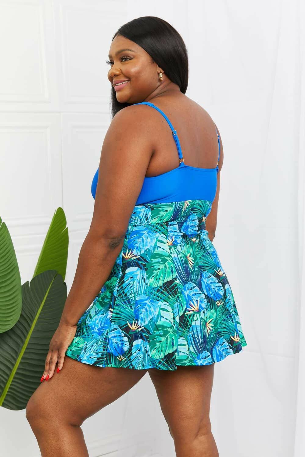 Blue Paradise V-Neck Swim Dress by Marina West SwimExperience Paradise in Style
 Step into a world of tropical elegance with the Blue Paradise V-Neck Swim Dress by Marina West Swim. This versatile swim dress is desigLove Salve -Neck Swim Dressswimwear