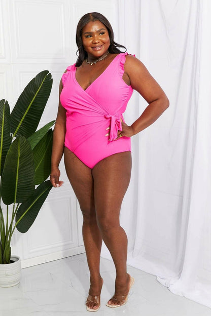 Chic pink ruffle wrap swimsuit with elegant tie and frilly straps