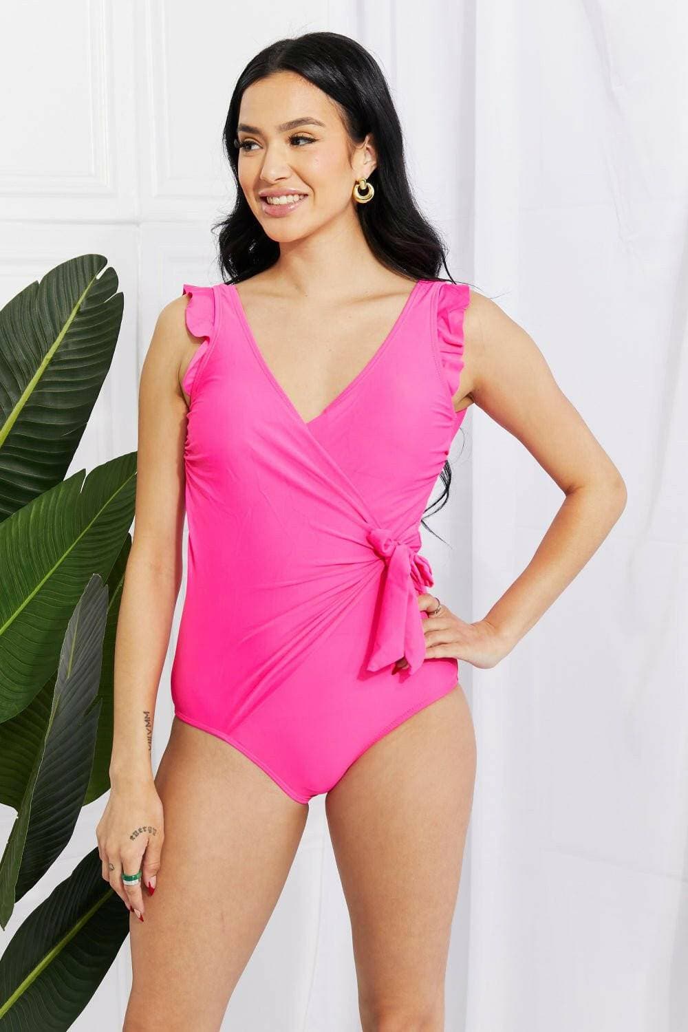 Chic pink ruffle wrap swimsuit with elegant tie and frilly straps