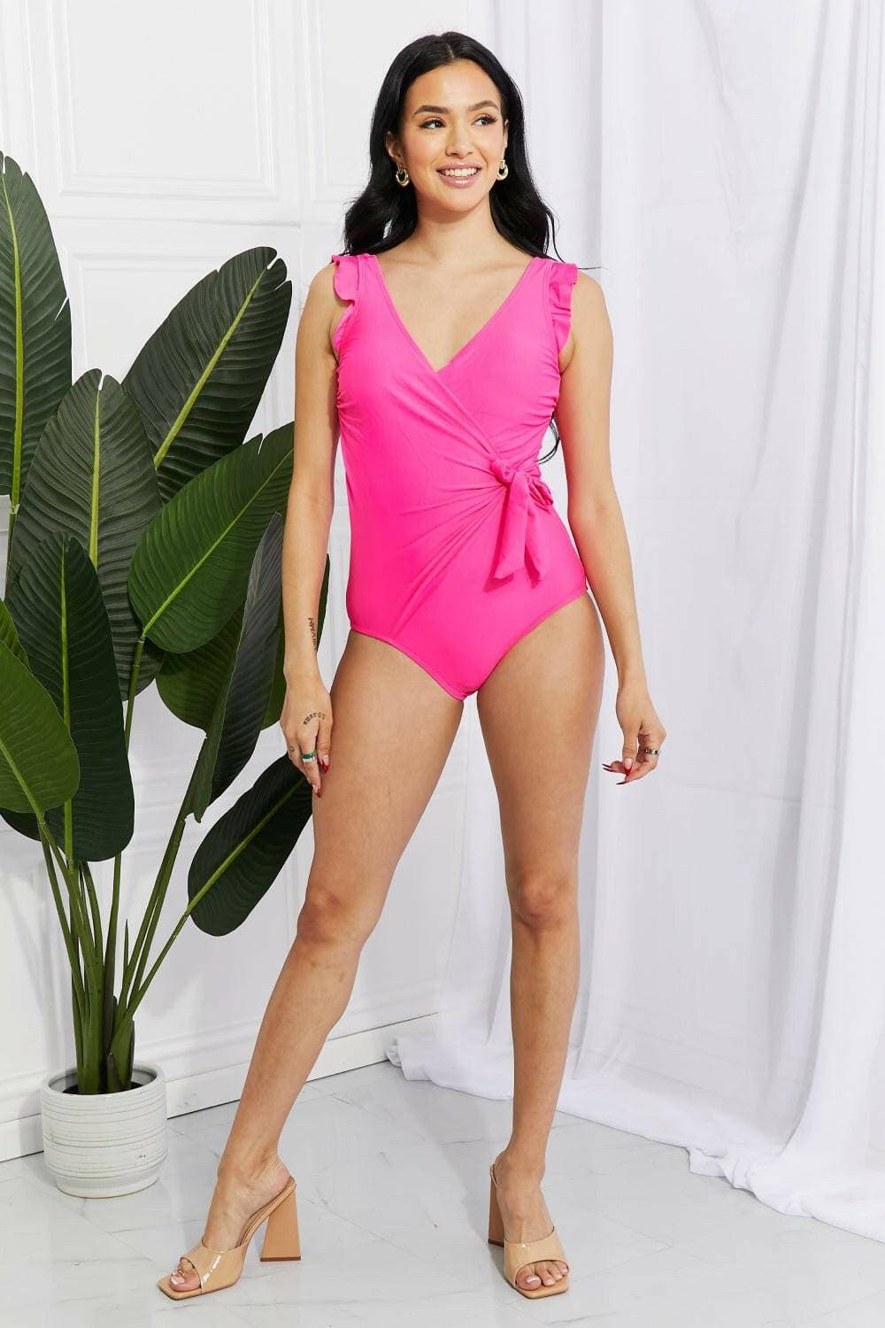 Chic pink ruffle wrap swimsuit with elegant tie and frilly straps