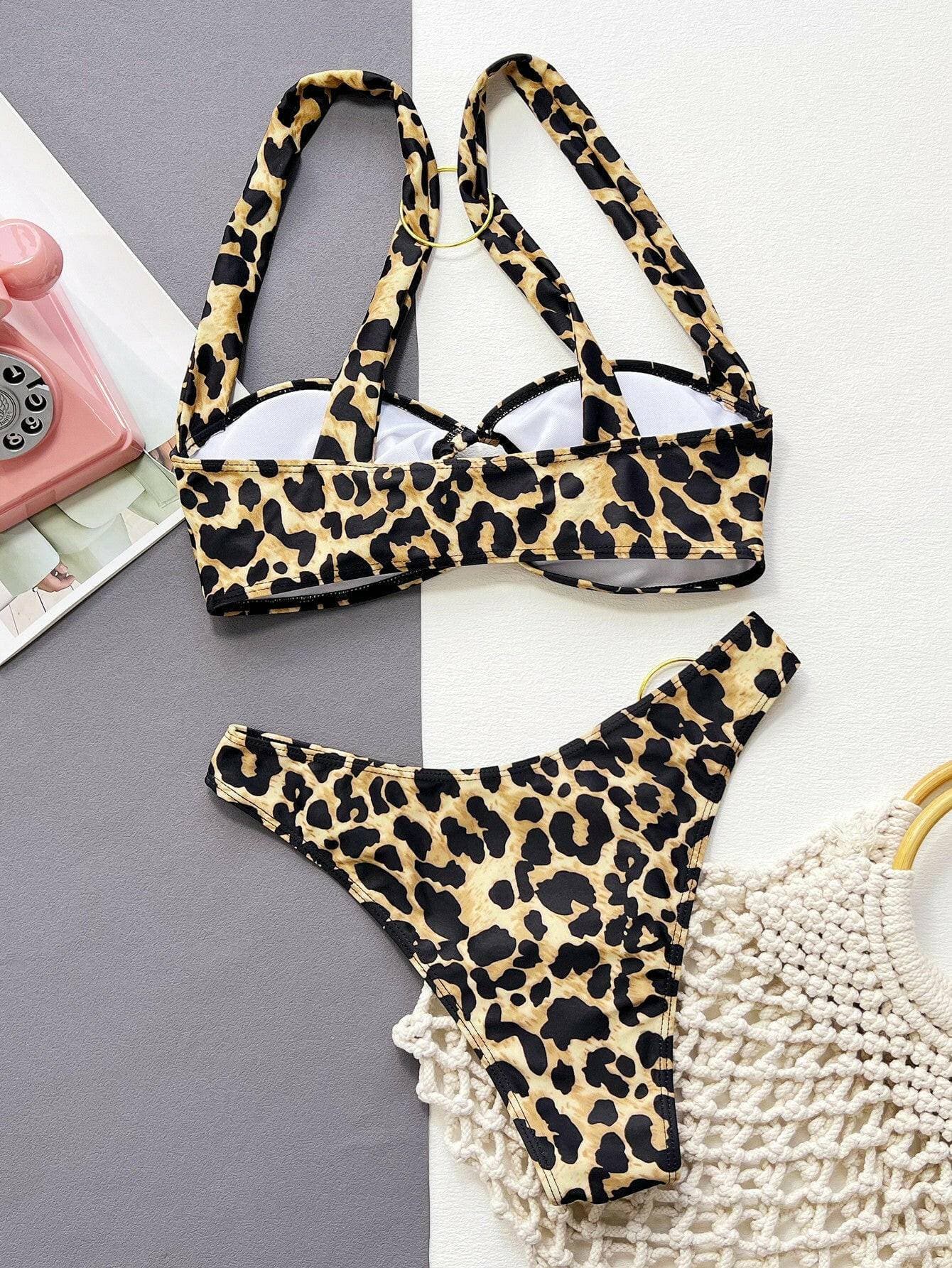 Leopard Print Bikini Set with Ring DetailLeopard Print Bikini Set with Ring Detail
 
 
Unleash Your Wild Side: Make a bold statement at the beach with our chic leopard print bikini set featuring a trendy riLove Salve Leopard Print Bikini Setswimwear