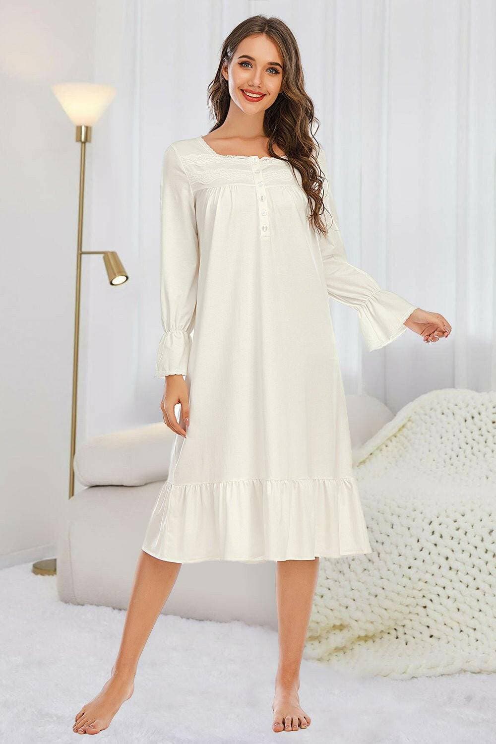 Elegant lace nightgown with ruffled hem and lace detail.