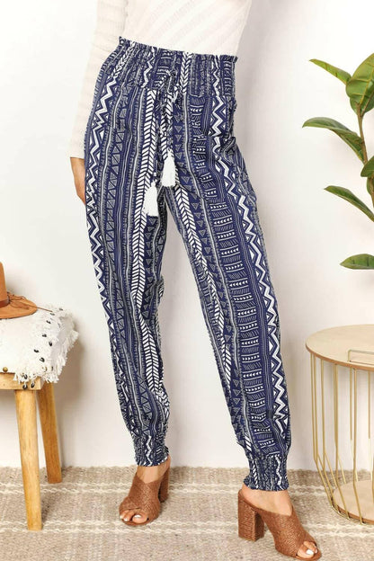 Geometric Print Tassel Embellished High-Rise TrousersGeometric Print Tassel Embellished High-Rise Trousers
 Make a Statement with our Geometric Print Tassel Embellished High-Rise Trousers. Perfect for fashion-forward iLove Salve Geometric Print Tassel Embellished High-Rise TrousersTIKTOK