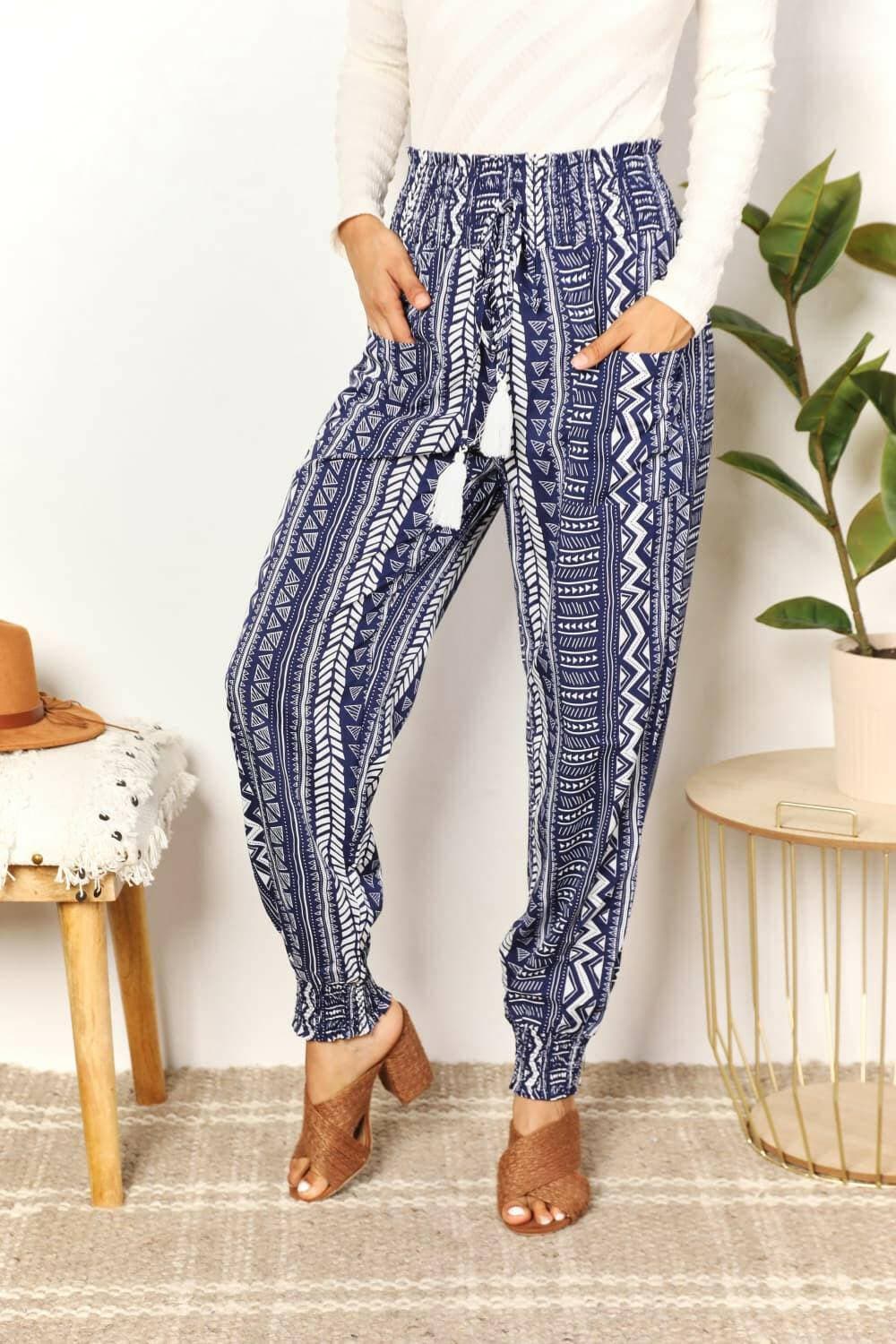 Geometric Print Tassel Embellished High-Rise TrousersGeometric Print Tassel Embellished High-Rise Trousers
 Make a Statement with our Geometric Print Tassel Embellished High-Rise Trousers. Perfect for fashion-forward iLove Salve Geometric Print Tassel Embellished High-Rise TrousersTIKTOK