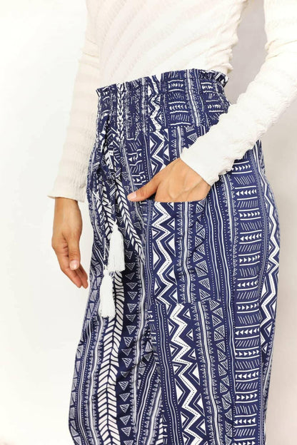 Geometric Print Tassel Embellished High-Rise TrousersGeometric Print Tassel Embellished High-Rise Trousers
 Make a Statement with our Geometric Print Tassel Embellished High-Rise Trousers. Perfect for fashion-forward iLove Salve Geometric Print Tassel Embellished High-Rise TrousersTIKTOK