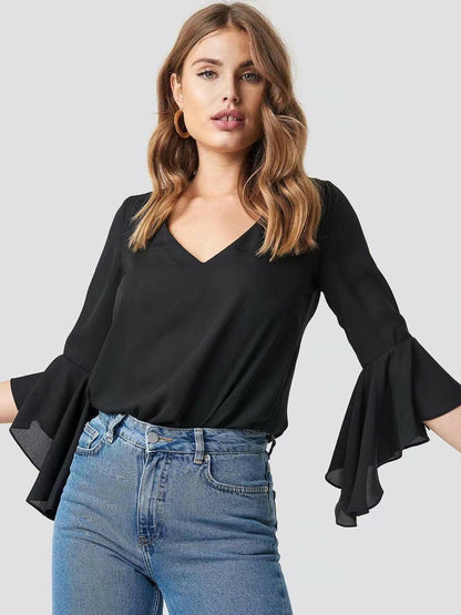 Flirty sheer blouse with flounce sleeves and V-neck in black.