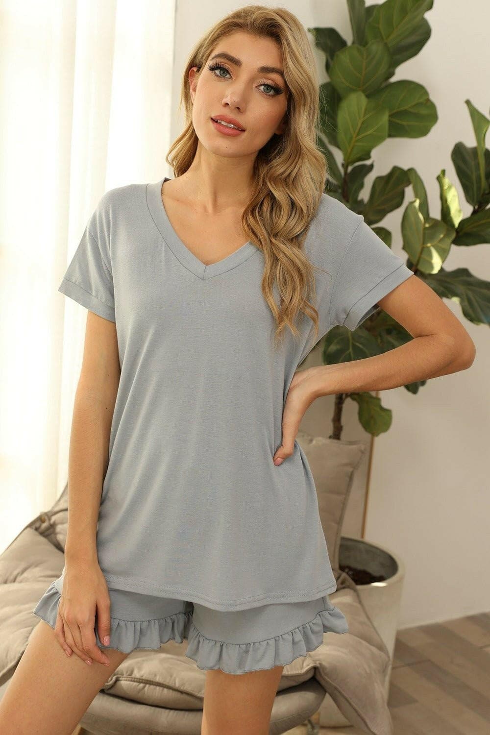 Cozy Chic V-Neck Lounge SetUpgrade Your Loungewear Game with our Cozy Chic V-Neck Lounge Set
 
 
Two-Piece Set: Embrace both comfort and style with a V-neck short sleeve top and drawstring shoLove Salve -Neck Lounge Setlounge