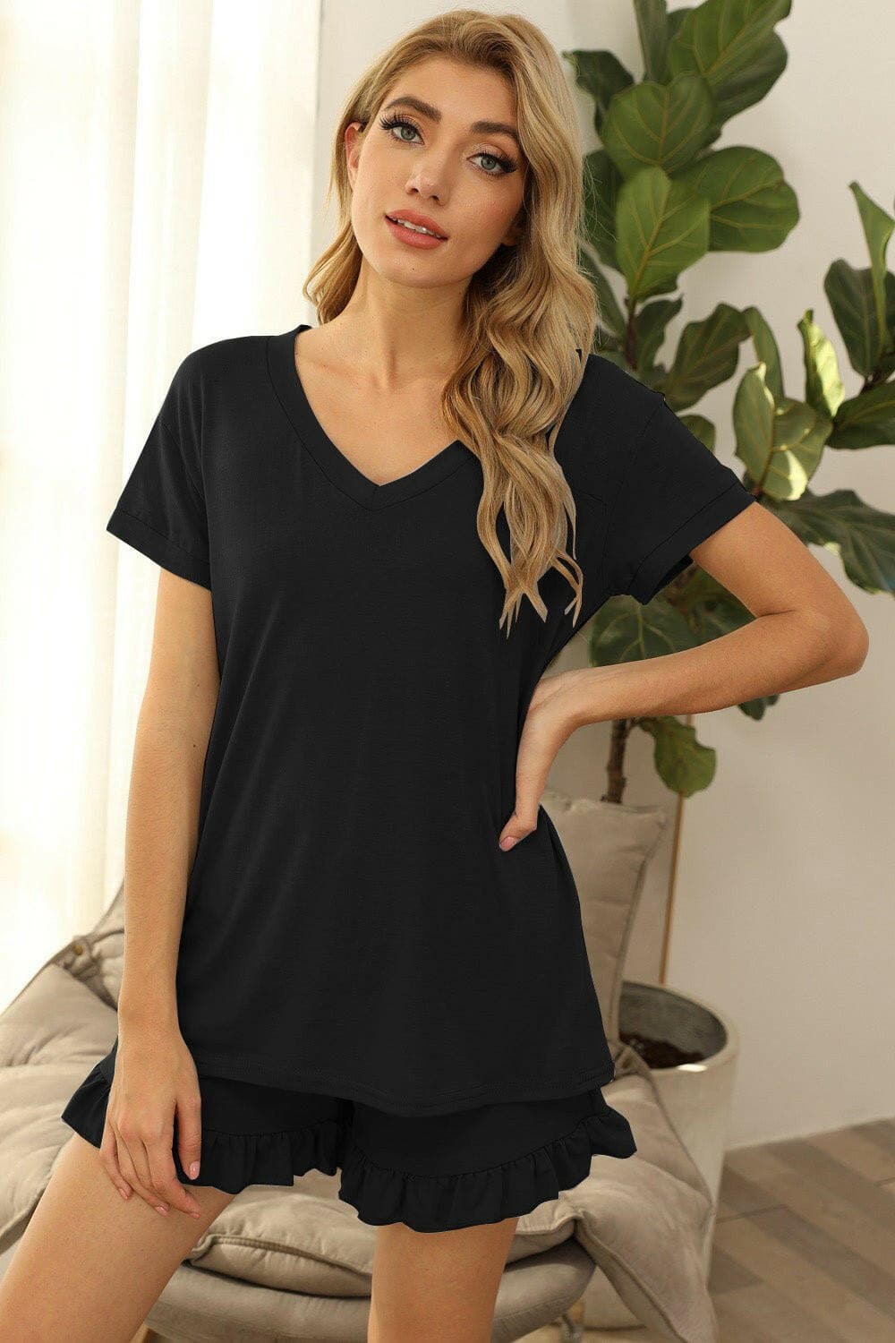 Cozy Chic V-Neck Lounge SetUpgrade Your Loungewear Game with our Cozy Chic V-Neck Lounge Set
 
 
Two-Piece Set: Embrace both comfort and style with a V-neck short sleeve top and drawstring shoLove Salve -Neck Lounge Setlounge